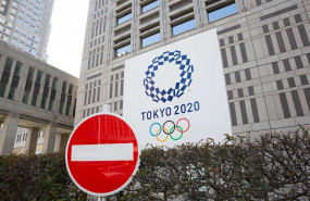 ep senal de trafico delante del edificio del comite organizador de los juegos olimpicos y
