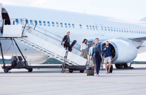 ep people disembarking a flight at commercial airport terminal group of people leaving the airplane
