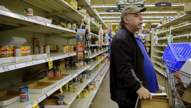 March 13, 2020 - Bloomington, Indiana, United States: Workers at a Kroger in Bloomington, Indiana restock shelves just before the store is shutting down for the night at midnight, Friday, March 13, 2020 in Bloomington, Indiana. A worker said they restock | Jeremy Hogan ep march 13 2020 - bloomington indiana united states workers at a kroger in bloomington indiana