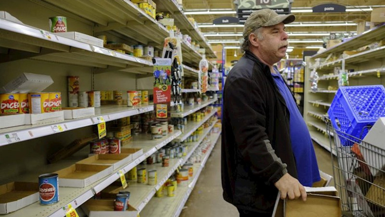 March 13, 2020 - Bloomington, Indiana, United States: Workers at a Kroger in Bloomington, Indiana restock shelves just before the store is shutting down for the night at midnight, Friday, March 13, 2020 in Bloomington, Indiana. A worker said they restock | Jeremy Hogan ep march 13 2020 - bloomington indiana united states workers at a kroger in bloomington indiana