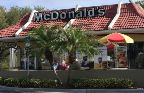 ep march 18 2020 - titusville florida united states- customers eat outdoors at a mcdonalds in