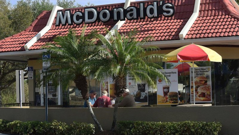 ep march 18 2020 - titusville florida united states- customers eat outdoors at a mcdonalds in ep march 18 2020 - titusville florida united states- customers eat outdoors at a mcdonalds in