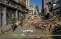 ep first responders walk down a rubble strewn street after mondays earthquake in pereira colombia on