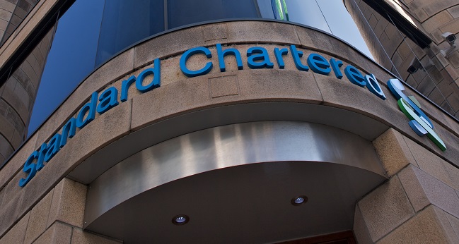 hsbc upgrades standard chartered cites