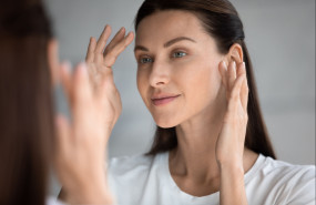 woman applying eye cream 