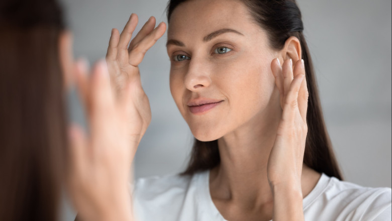 woman applying eye cream 
