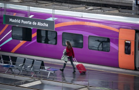 ep archivo   una mujer con una maleta en una de las vias de la estacion puerta de atocha almudena