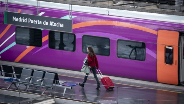 ep archivo   una mujer con una maleta en una de las vias de la estacion puerta de atocha almudena