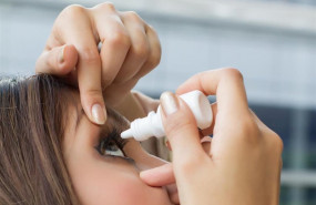 ep woman using eye drop eye lubricant to treat dry eye or allergy