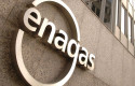 ep archivo - sede central de enagas y logo de la compania